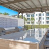 an outdoor grill with a large island and chairs