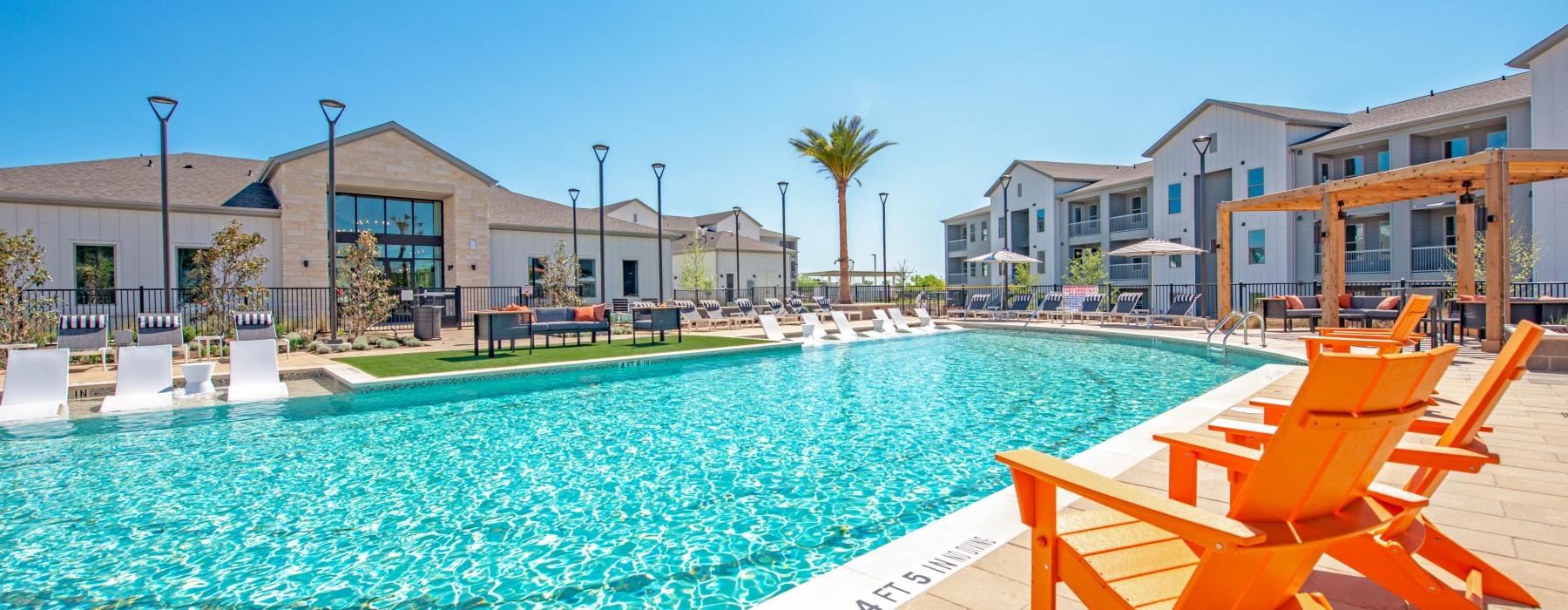 a pool with chairs around it