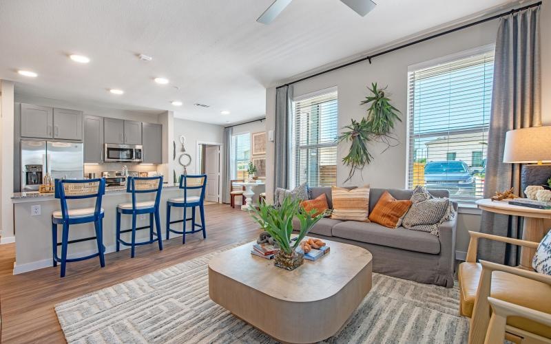 a living room with a couch and chairs